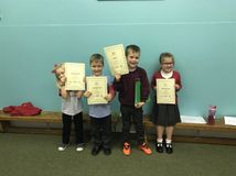 Small students with big certificates.